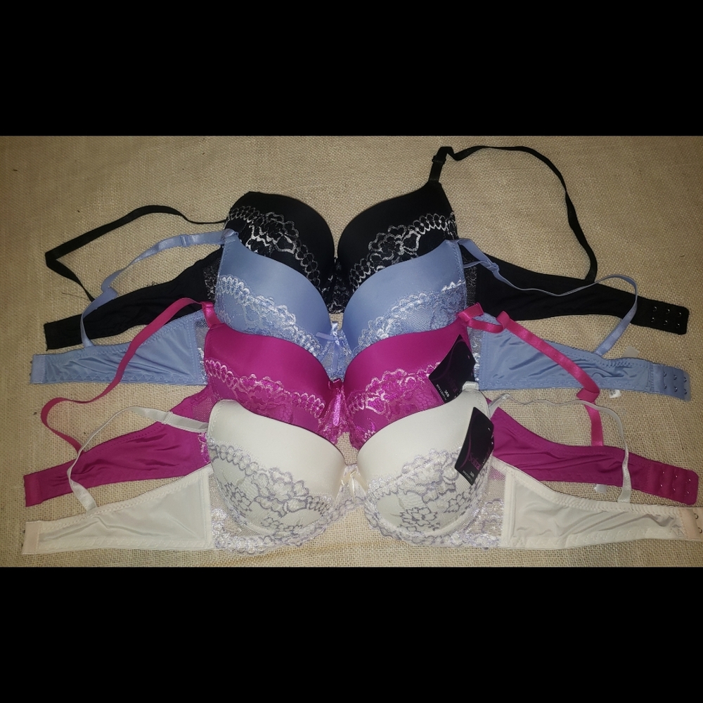 Four pretty, enhancing push-up bras ivory, magenta pink, black & periwinkle blue